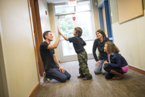 Man giving high five to child