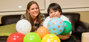 child with balloons